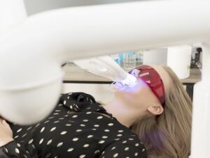 young woman in dentist chair having teeth whitene 2021 11 18 00 48 29 utc 1